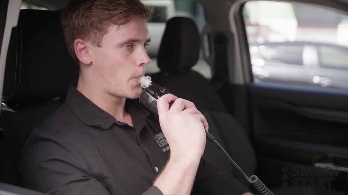 Driver blowing into an interlock handset