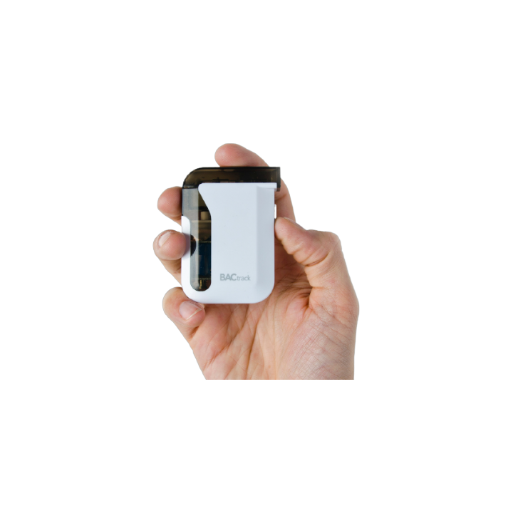 Smart Breath breathalyser held in one hand